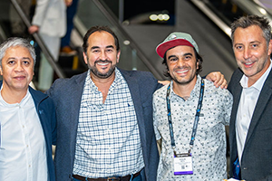 A Group Of Men Standing Next To Each Other At NAB 2024