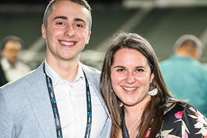 A Man And A Woman Standing Next To Each Other At NAB 2024