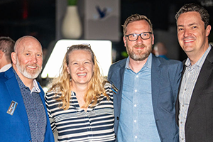 A Group Of People Standing Next To Each Other At NAB 2024