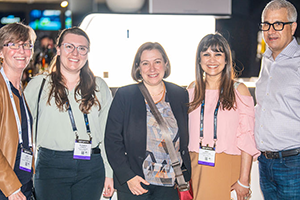 A Group Of People Standing Next To Each Other At NAB 2024