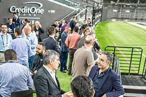 A Group Of Soccer Fans Cheering At A Stadium During A Match At NAB 2024