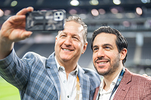 Two Men Taking A Selfie In A Stadium At NAB 2024