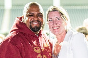 A Man And A Woman Posing For A Picture At NAB 2024