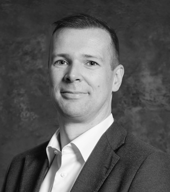 black and white photo of a man in a suit