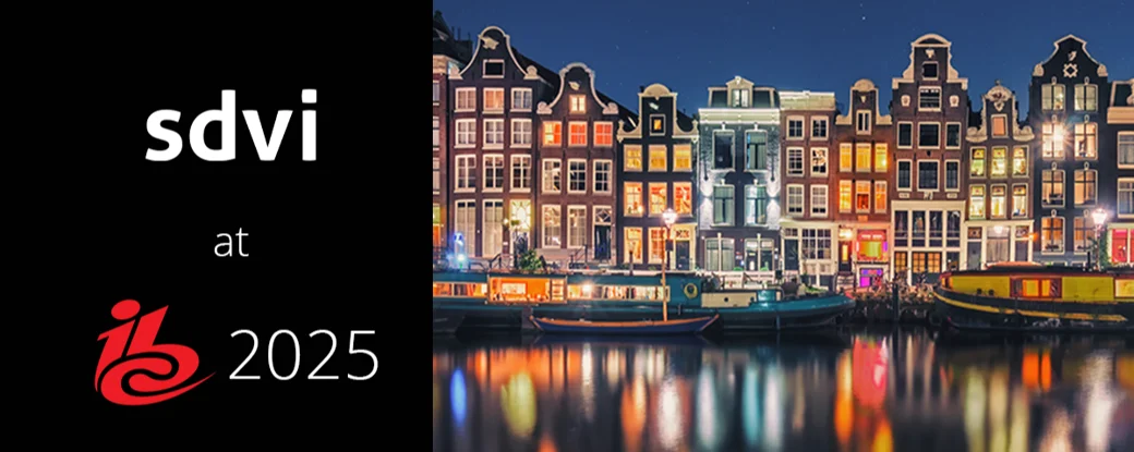 picture of a city at night with the words SDVI at IBC 2025 at the bottom